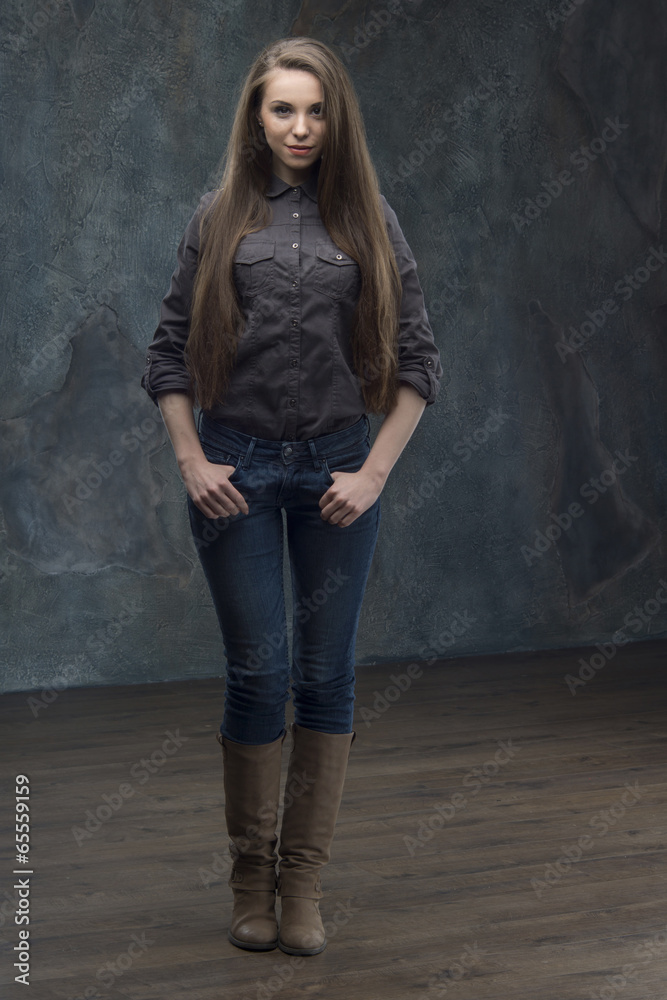 Fototapeta premium Woman standing on dark background