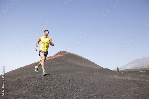 Man running outdoors, cross country trail run