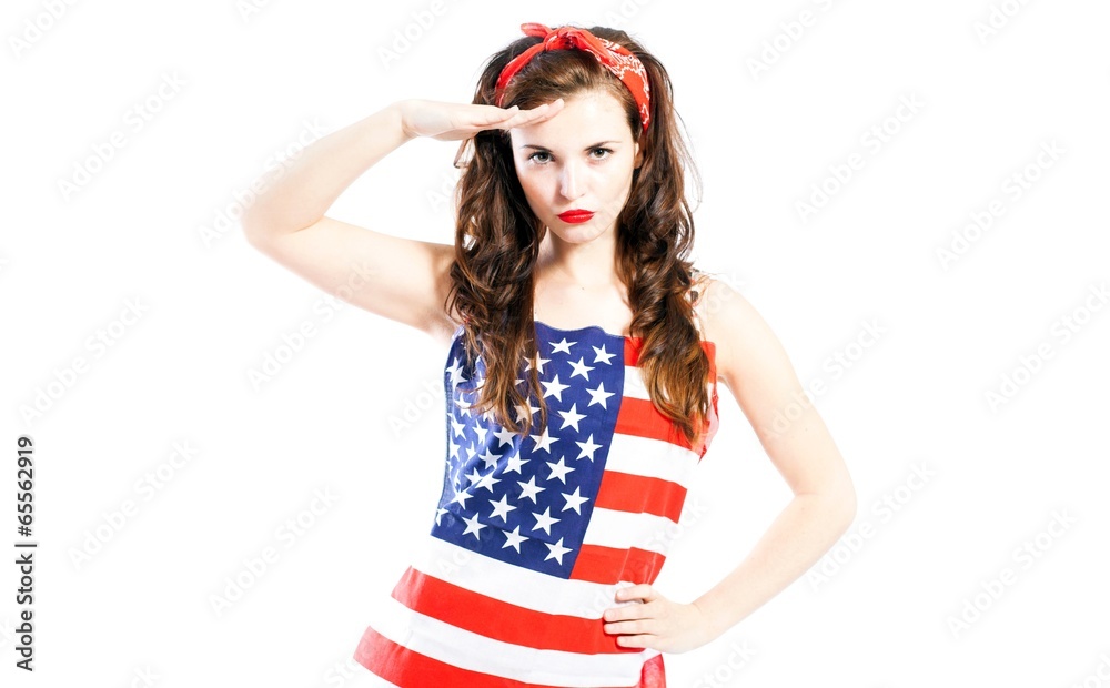 Pin up girl wrapped in american flag saluting Pin up girl wrapped in american flag saluting