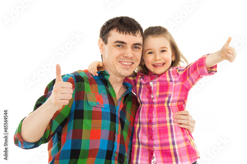 Joyful father with daughter showing thumbs up © svetabezu