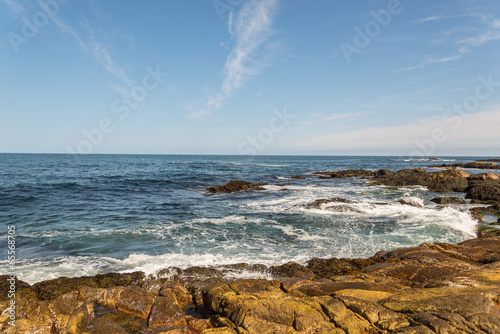 Ocean waves crashing against shore