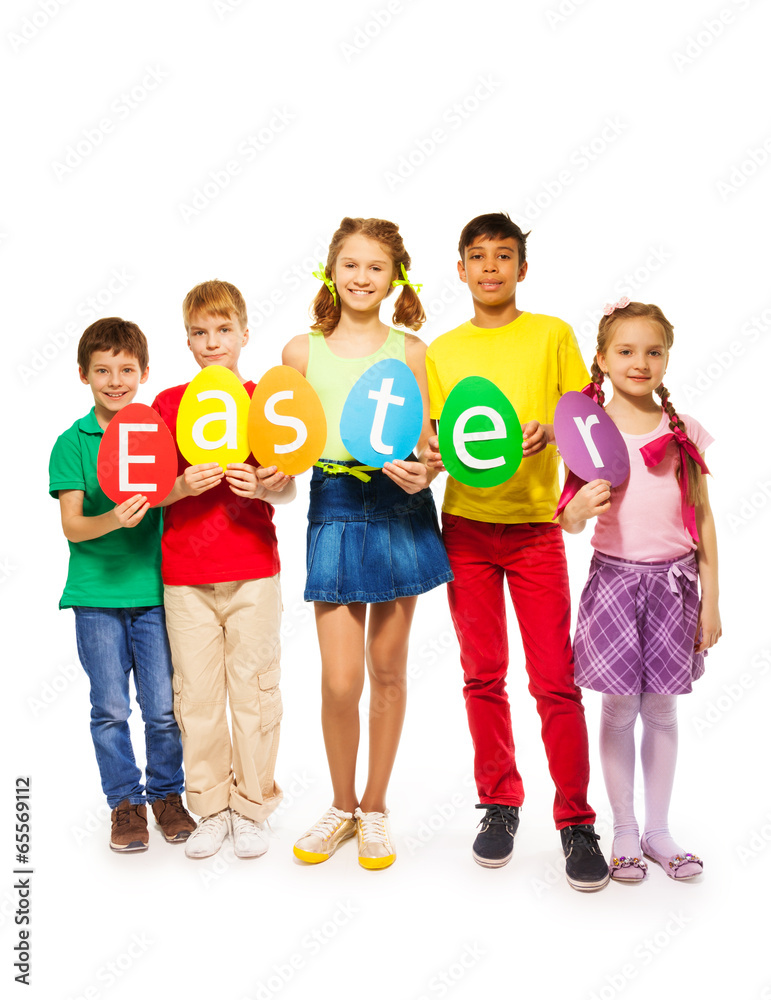Children holding egg shape colourful cards in row Children holding egg shape colourful cards in row