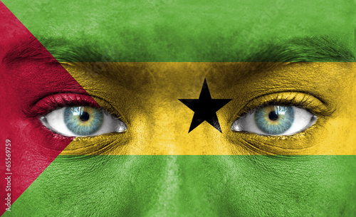 Human face painted with flag of Sao Tome and Principe