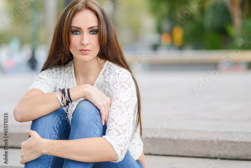 Young woman, wearing casual clothes, with long hair