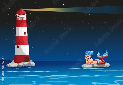A smiling mermaid across the lighthouse