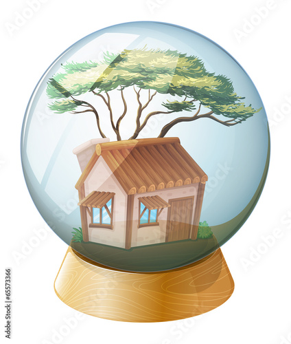 A crystal ball decor with a house inside