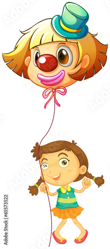 A young girl holding a clown balloon