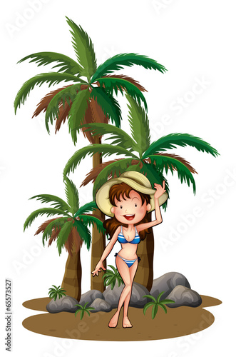 A beautiful girl near the palm trees