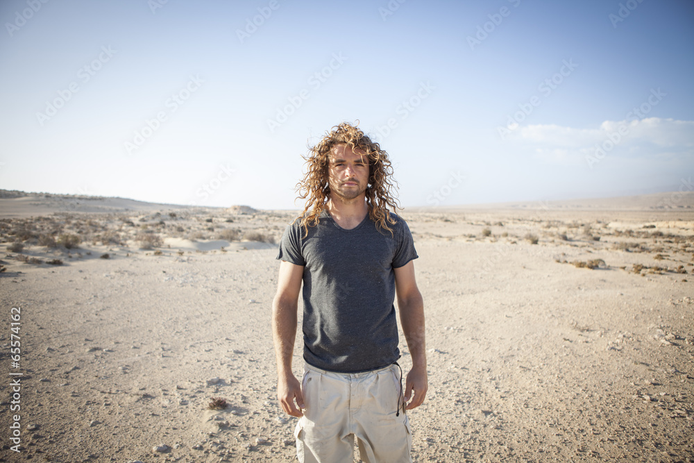 young man walking alone in the desert young man walking alone in the desert