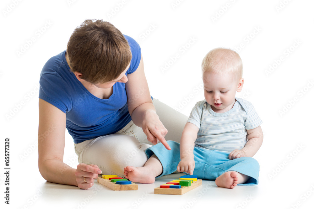 baby and his mom play together with puzzle toys baby and his mom play together with puzzle toys