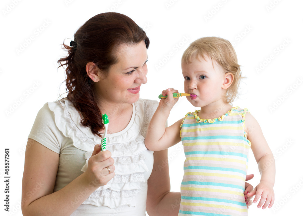 mother and child daughter brushing teeth in bathroom mother and child daughter brushing teeth in bathroom