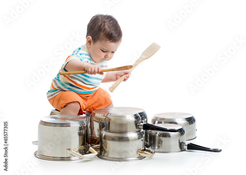 kid boy drumming playing wi...