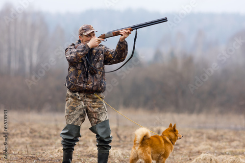 hunter aiming at duck