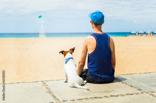 dog and boy at the beach