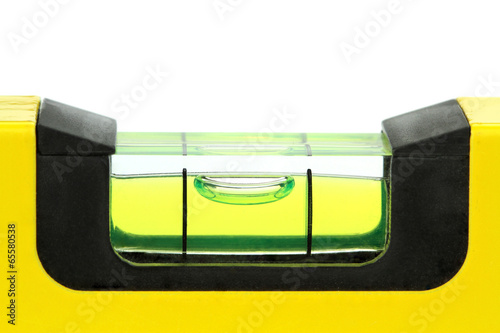 Yellow spirit level , macro image, on white background photo