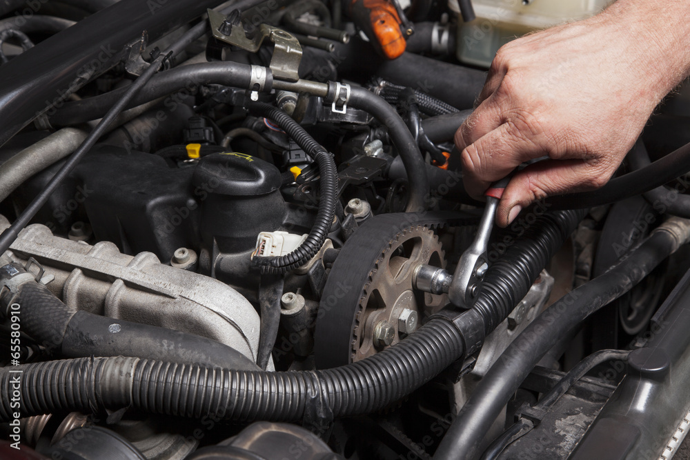 Person Repairing Car Engine Person Repairing Car Engine