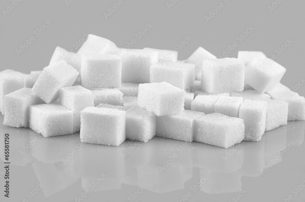 Sugar cubes isolated on gray  background