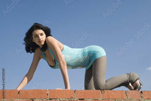 Young woman on roof © Aikon