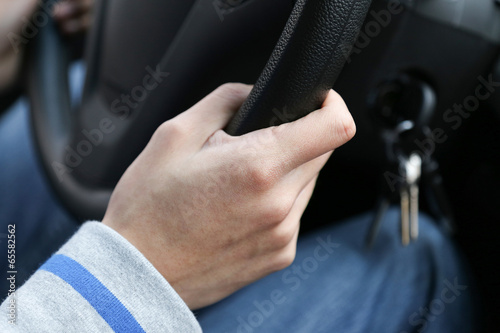 hand on the  steering wheel © xiefei