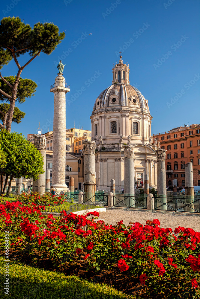 Fototapeta premium Trajan's Column with church in Rome, Italy