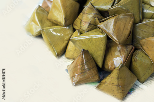 Sticky rice wrapped in banana leaves - dessert Thailand.