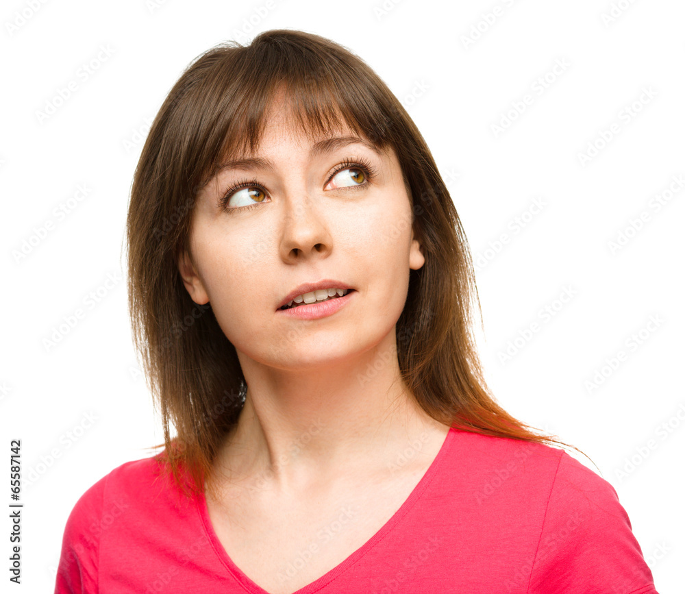 Young happy woman is looking up and smile Young happy woman is looking up and smile