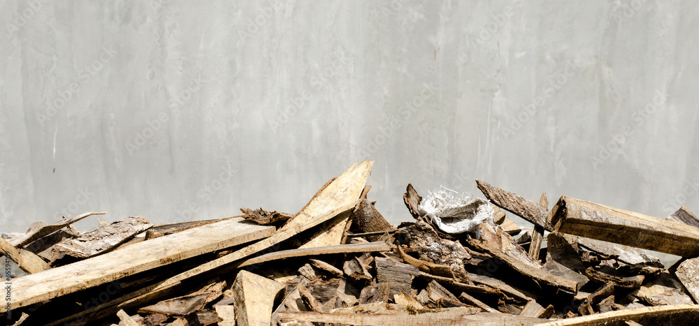 Cement wall and scraps of wood foreground Cement wall and scraps of wood foreground