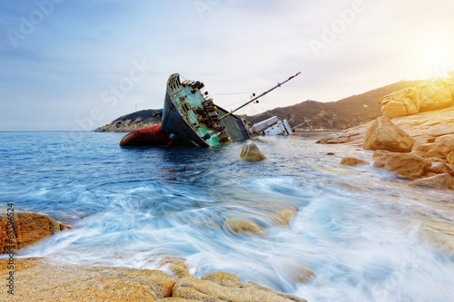 Photography shipwreck and seascape sunset