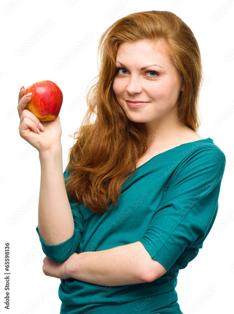 Young happy girl with apple Young happy girl with apple