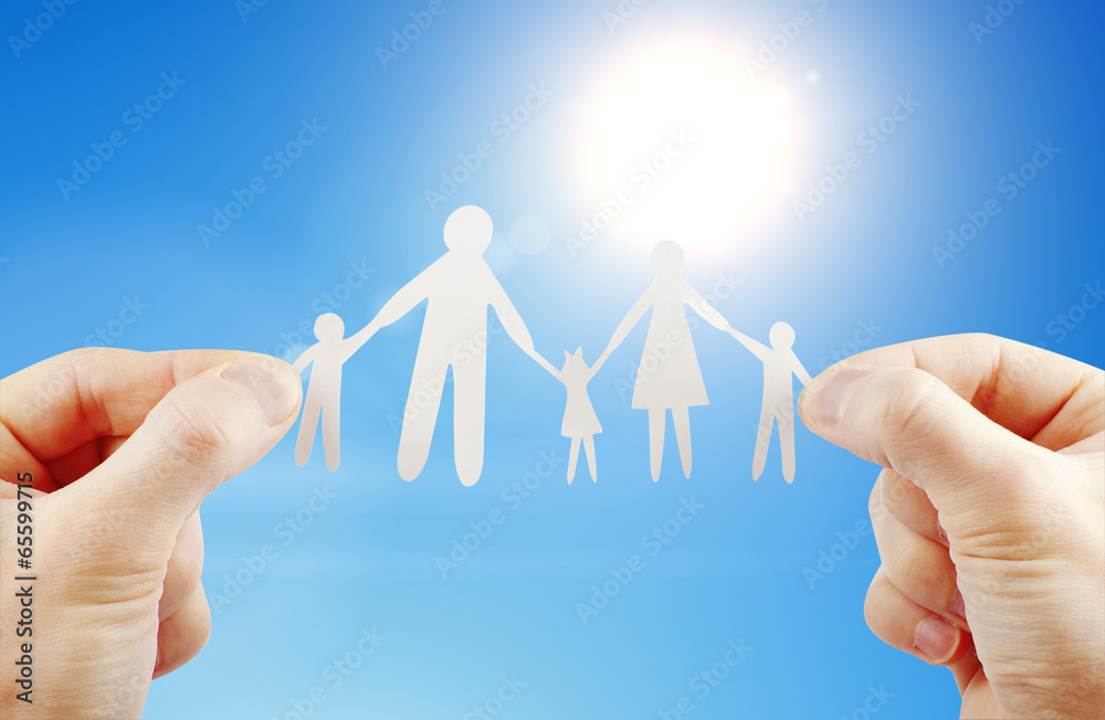 paper family in hands paper family in hands