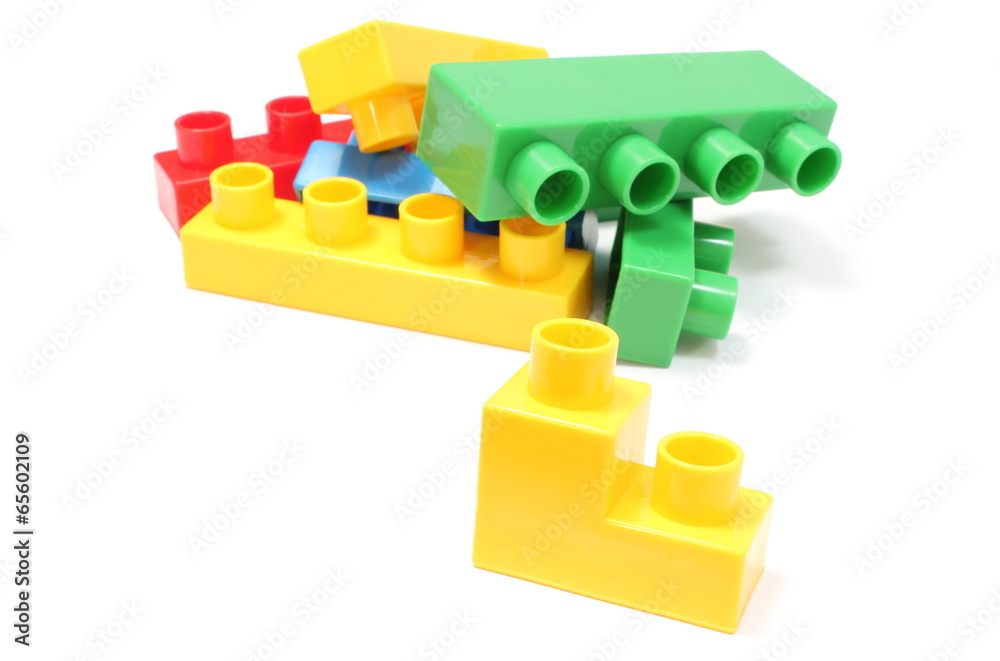 Fototapeta premium Colorful building blocks for children on white background