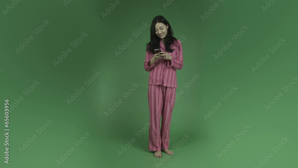 young asian adult woman in pajamas isolated on green-screen young asian adult woman in pajamas isolated on green-screen