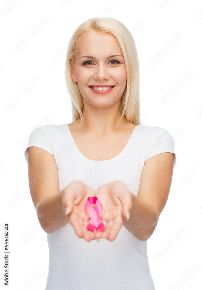 woman holding pink cancer awareness ribbon woman holding pink cancer awareness ribbon