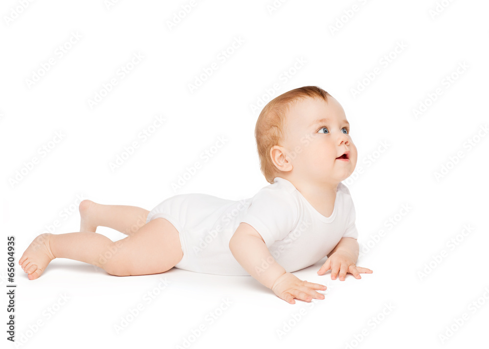 smiling baby lying on floor and looking up smiling baby lying on floor and looking up