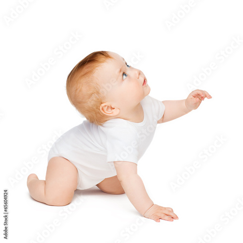 Obraz na plátne crawling curious baby looking up