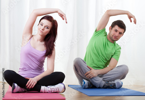 Couple taking yoga classes