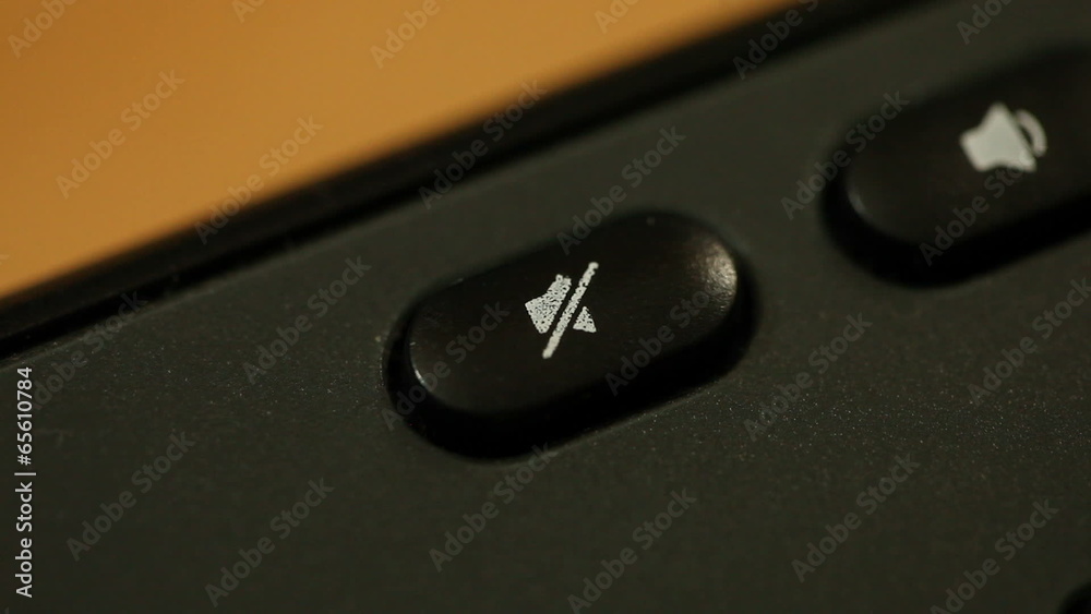Finger pressing button with no sound symbol on keyboard Finger pressing button with no sound symbol on keyboard