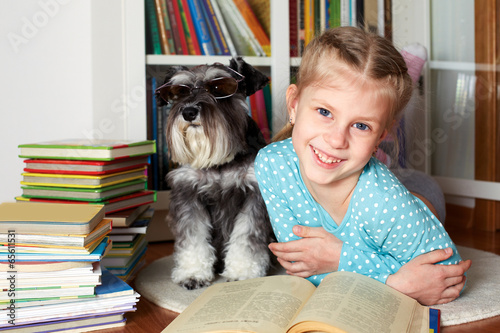 girl and dog reading books
