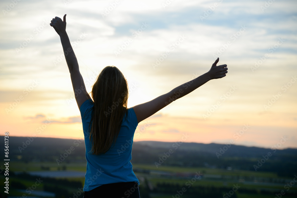 happy young woman outdoor rising hands and looking at sunset happy young woman outdoor rising hands and looking at sunset