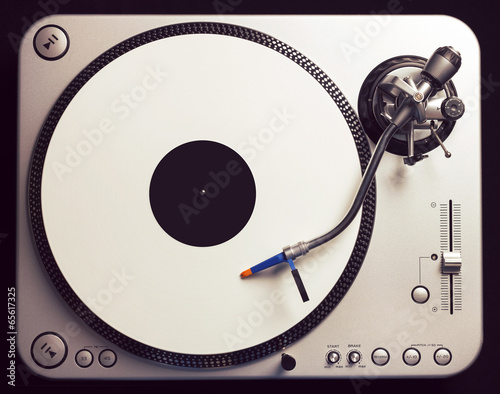 Old fashioned turntable playing a track