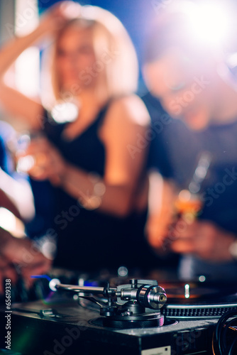 Party people in front of turntable