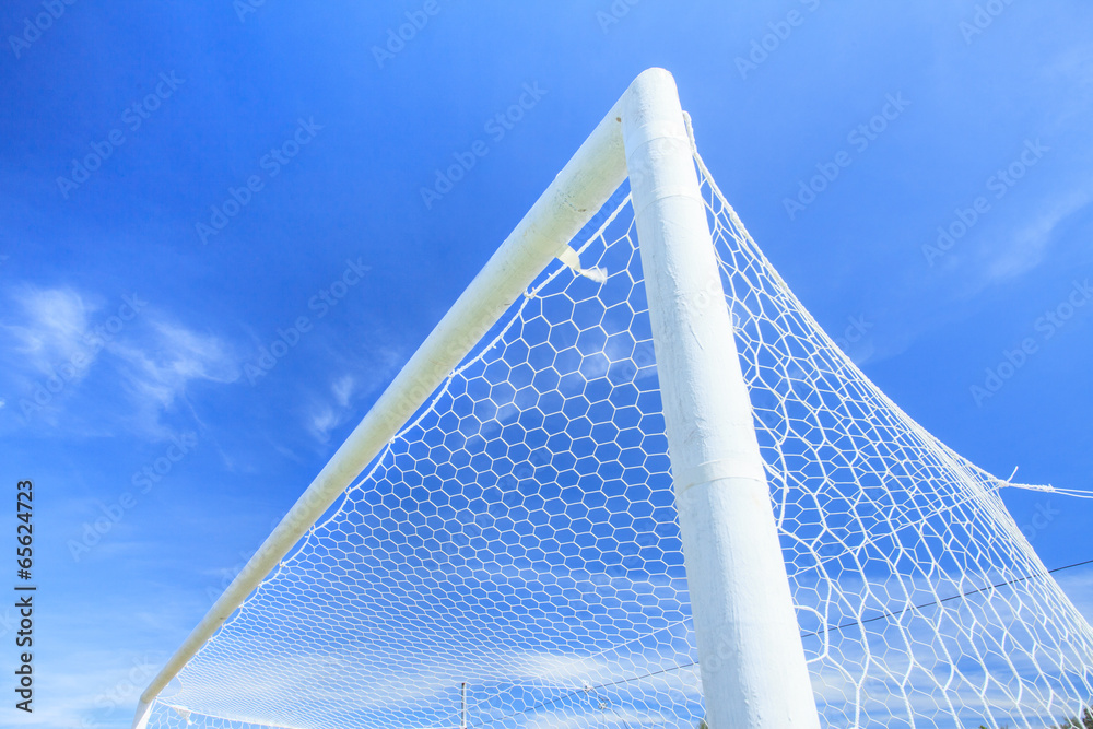 Fototapeta premium White Net Soccer Goal Ready for next Macth in blue sky background.
