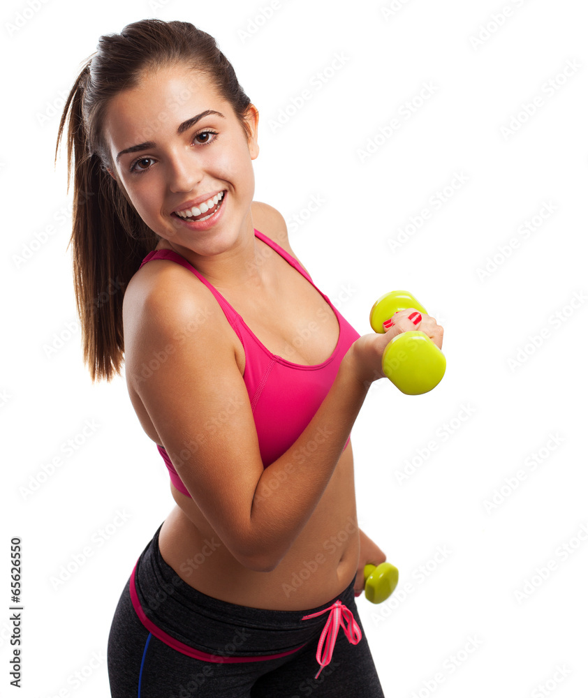 Pretty teenager with weights isolated on a white background Pretty teenager with weights isolated on a white background