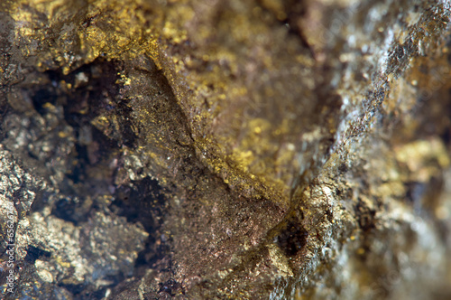 Nugget, gold, bronze, copper, iron. Macro. Extreme closeup