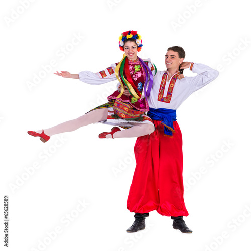 beautiful dancing couple in ukrainian polish national