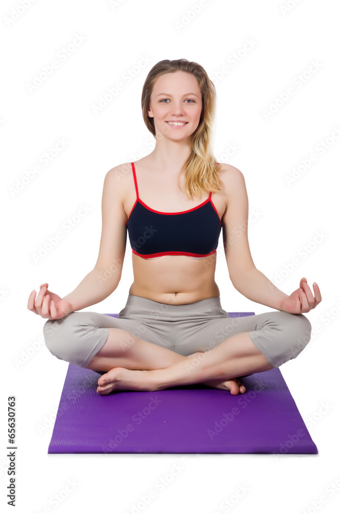 Young female doing exercises on white