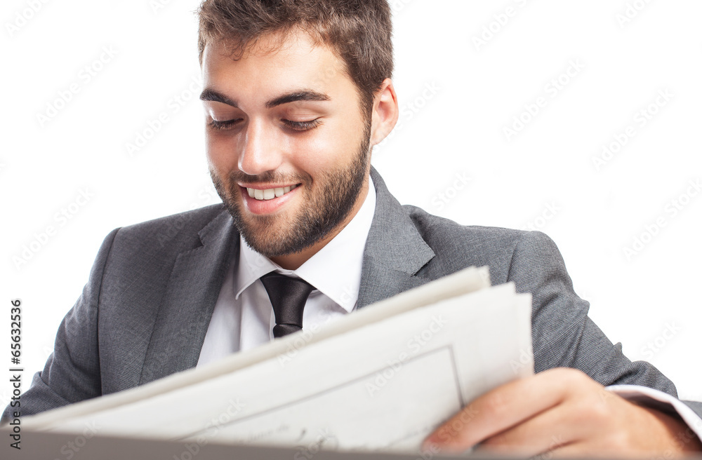 young business man reading a newspaper isolated on white young business man reading a newspaper isolated on white