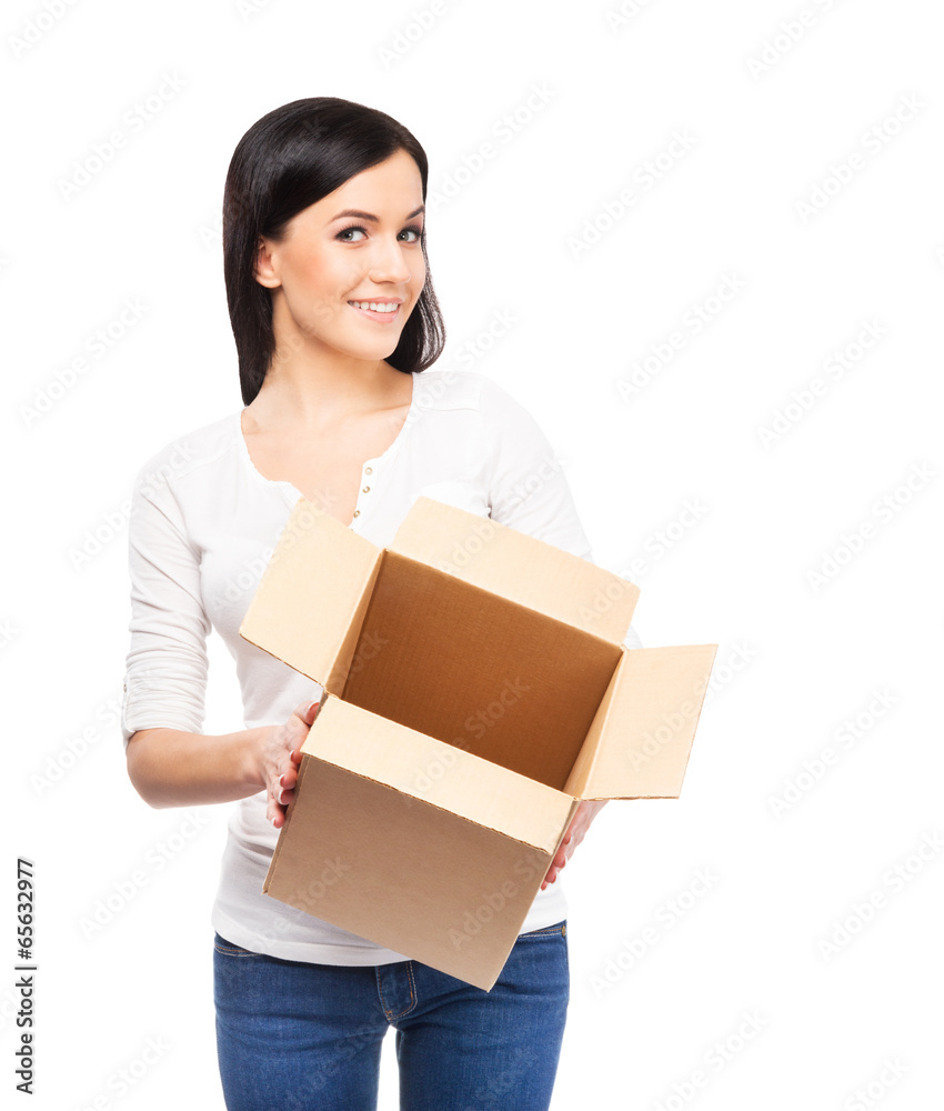 Young and attractive girl with a cardboard box isolated on white Young and attractive girl with a cardboard box isolated on white