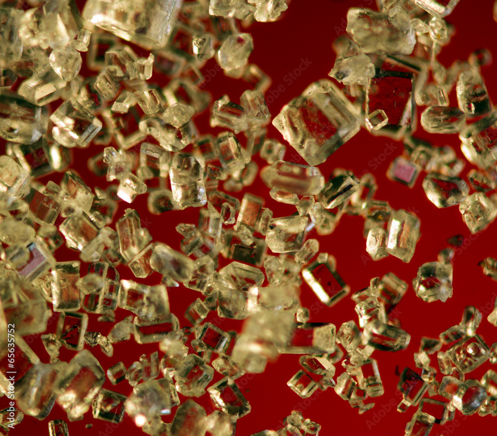 Crystals on a red background. Extreme closeup. Macro