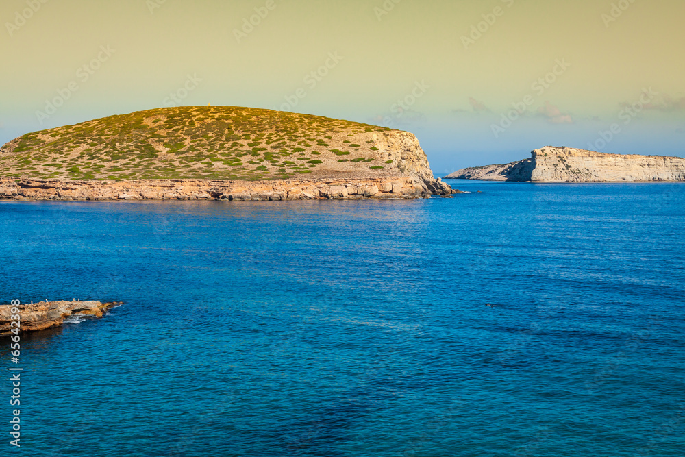 beautiful island and turquoise waters in Cala Conta, Ibiza Spain